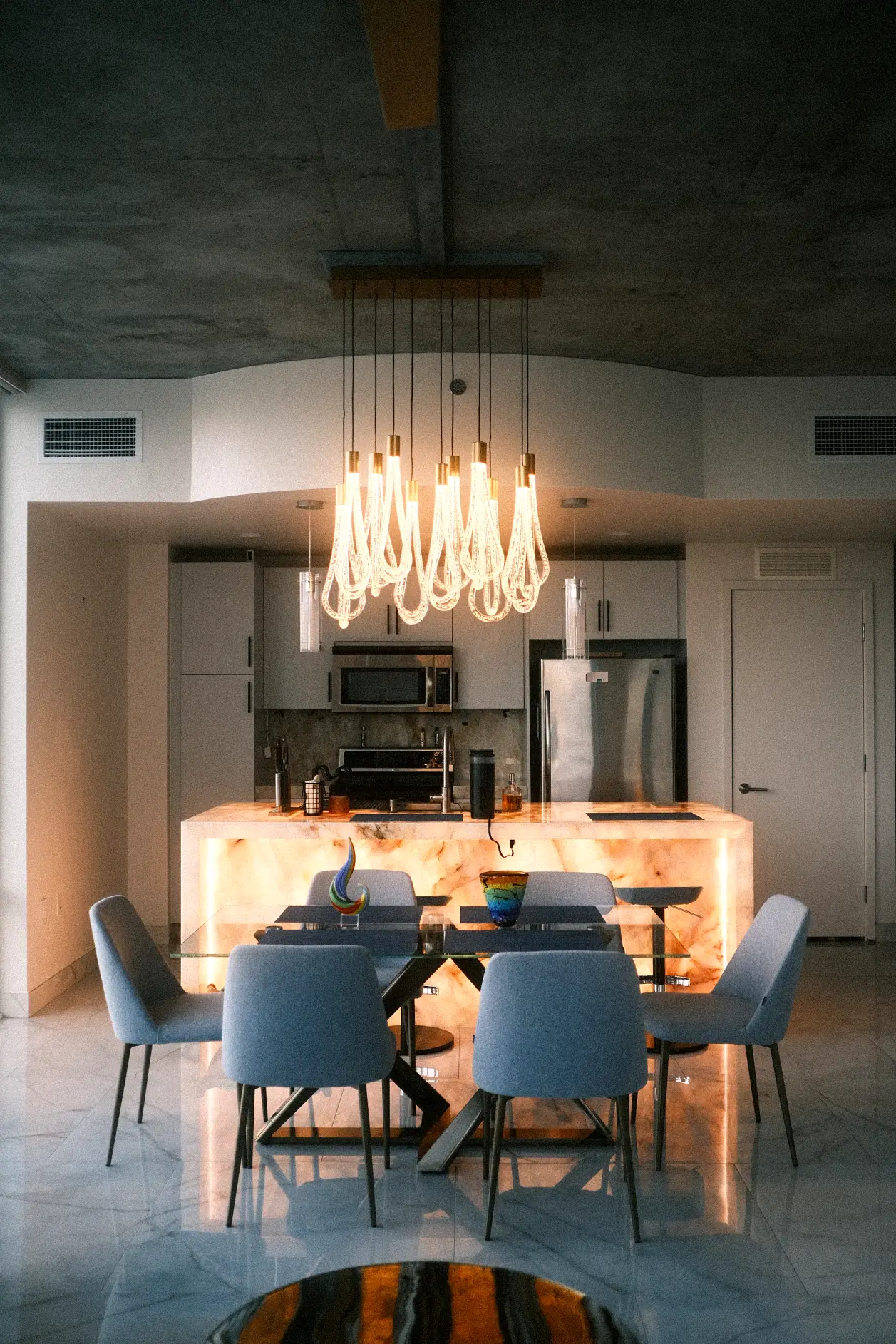 Luxury Kitchen with a Glowing Centerpiece Island in Denver by Fork River Construction